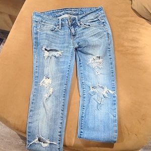 Woman's American Eagle Skinny jeans with the worn look. Size 0. Like new